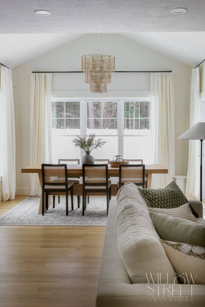 bright and airy white kitchen with zellige tile timeless brass fixtures and layered organic textures designed by interior design firm willow street interiors in Massachusetts
