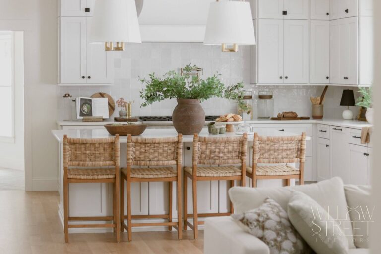 bright and airy white kitchen with zellige tile timeless brass fixtures and layered organic textures designed by interior design firm willow street interiors in Massachusetts