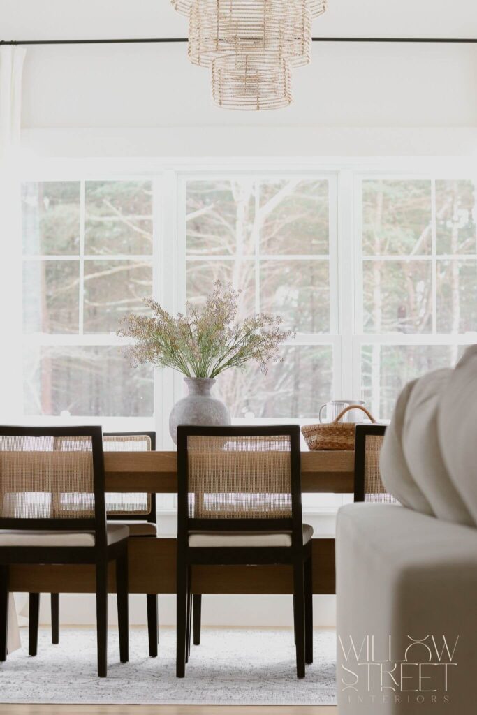 bright and airy white kitchen with zellige tile timeless brass fixtures and layered organic textures designed by interior design firm willow street interiors in Massachusetts
